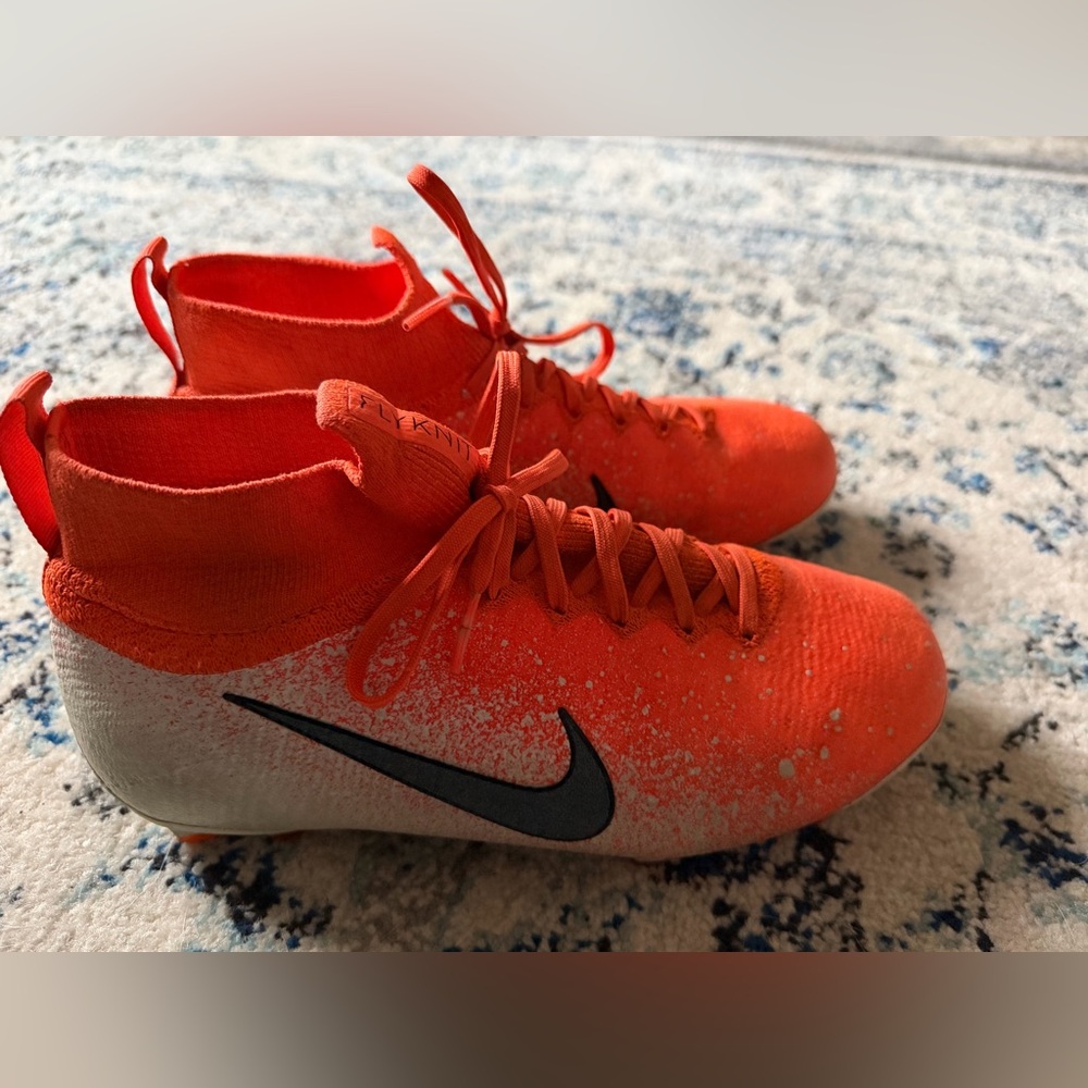 Nike Red-Orange Flyknit Soccer Cleats with Black Swoosh